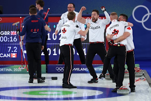 The Canadians celebrate their winning moment.