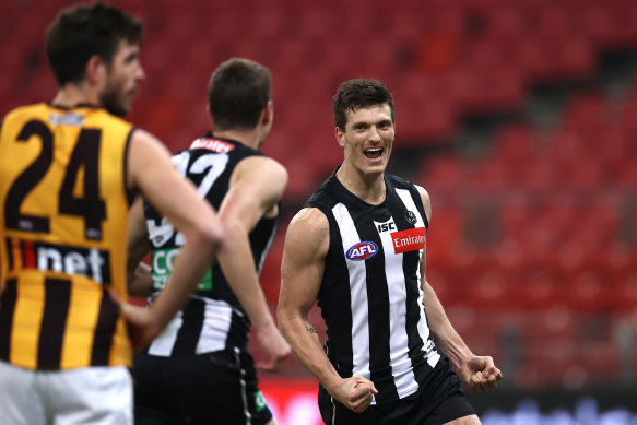 Brody Mihocek celebrates one of his four goals for the Magpies in their win over Hawthorn at Giants Stadium.