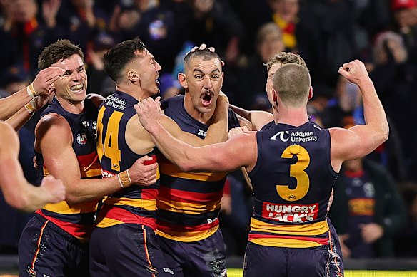 Taylor Walker celebrates his 700th career goal last round.