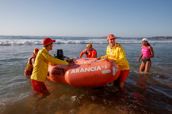 North Narrabeen SLSC Club patrol captain Adrian Hill with volunteers Jason Perry (front left) Jacque Grimes, Jacinta Perry and John Beaumont hit the water.