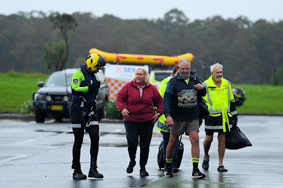 Oaxley Island residents Liz Brennan, her husband Paul Brennan (2nd from right) and a neighbour (right).