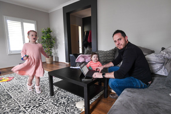 Danny Whelan with his children Phoebe, 5 and Pippa, 1.  Mr Whelan says it will be "impossible" for him to look after his children while working full-time from home.
