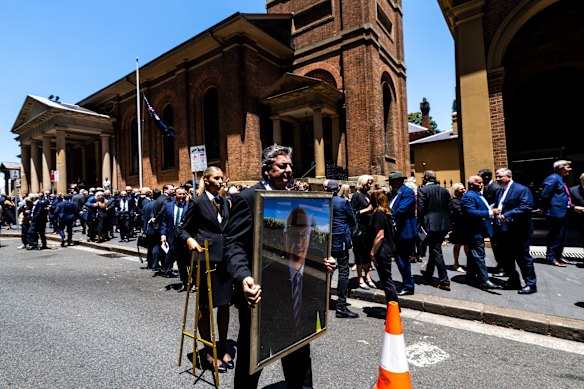 The crowd spilled onto the street after Graham Richardson’s funeral.