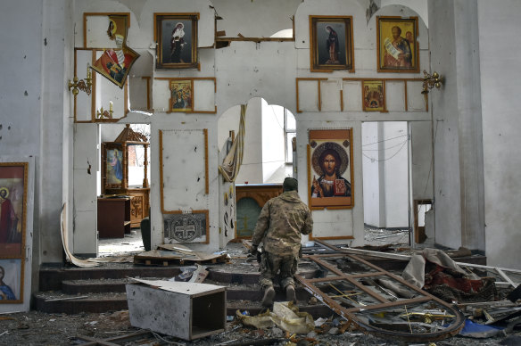 A Ukrainian serviceman prays in a church damaged in the Russian air raid in the town of Orikhiv, Zaporizhzhia region, Ukraine.