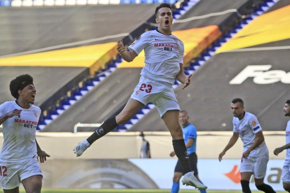 Sergio Reguilon celebrates his first goal for Sevilla in the round-of-16 win over Roma.