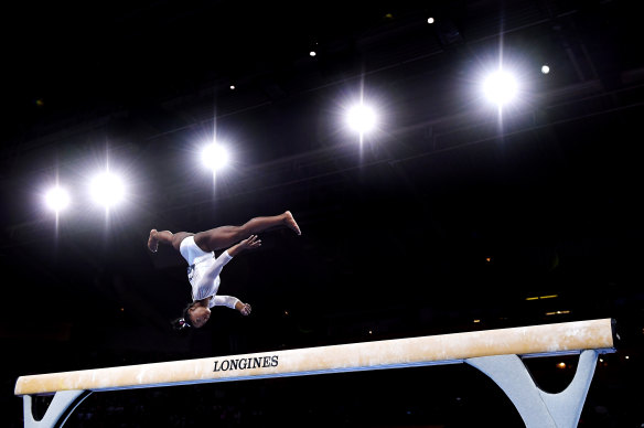 Biles in action on the balance beam during her all-around world title win.