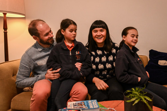 Nghi Whelan, with husband, Chris, and daughters Freya and Odette, says the intellectual stimulation, using her education in occupational therapy, role-modeling and financial needs are drivers for remaining heavily engaged with work.