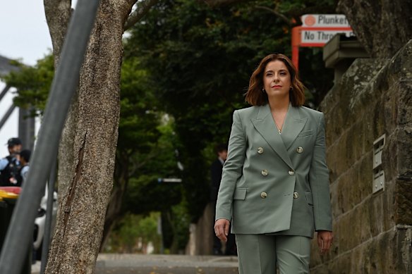 Communications Minister Anika Wells arrives for a press conference on Wednesday before attending an event at Kirribilli House marking the world’s first teenage social media ban. 