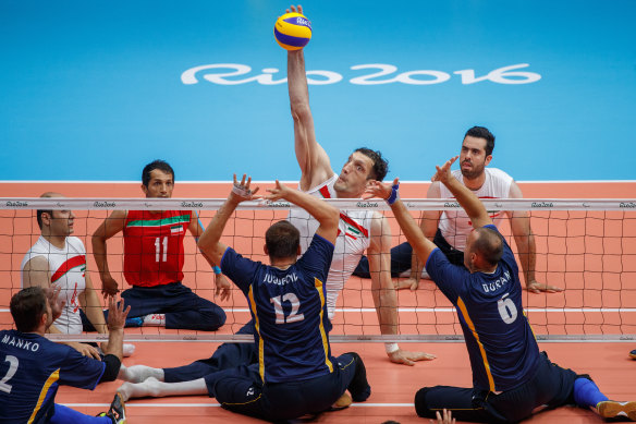 Morteza Mehrzadselakjani stretches to play the ball.