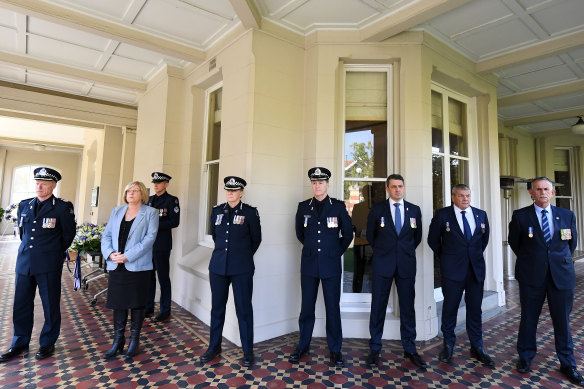 Deputy Commissioner Rick Nugent, Police Minister Lisa Neville, Deputy Commissioners Wendy Steendam and Shane Patton, Police Association secretary Wayne Gatt and president John Laird, and Police Legacy chief executive Lex de Man during a wreath laying ceremony.