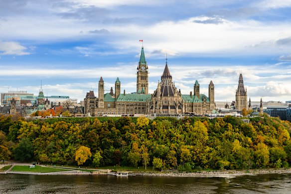 Autumn foliage cascading down from Parliament Hill across the Ottawa River.