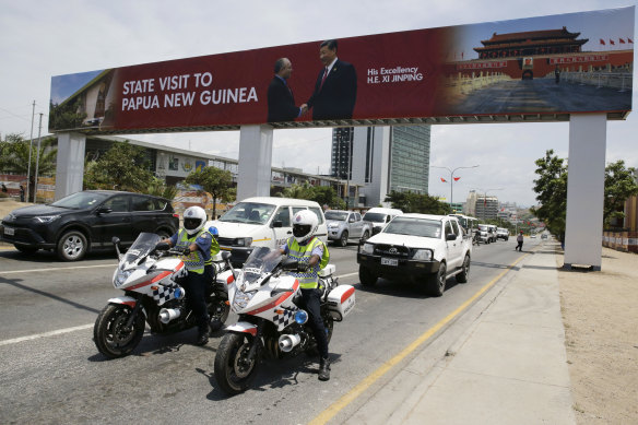 A billboard showing Chinese President Xi Jinping with PNG PM Peter O’Neill in Port Moresby ahead of an APEC meet. 