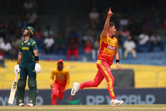 Travis Head reacts to his dismissal, as does the bowler Brad Evans.