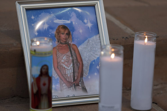 Candles placed next to a photograph of cinematographer Halyna Hutchins.
