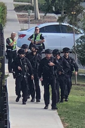 Police storm Adelphi Boulevard in Point Cook on Monday following reports of gunshots being fired. 