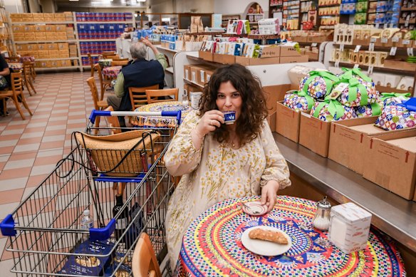 Julia takes a break for a $2 espresso and a ricotta cannoli.