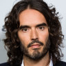 Comedian Russell Brand denies allegations of sexual assault published by three UK news organisations