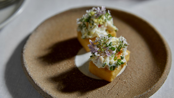 Crispy panisse topped with spanner crab and kohlrabi.