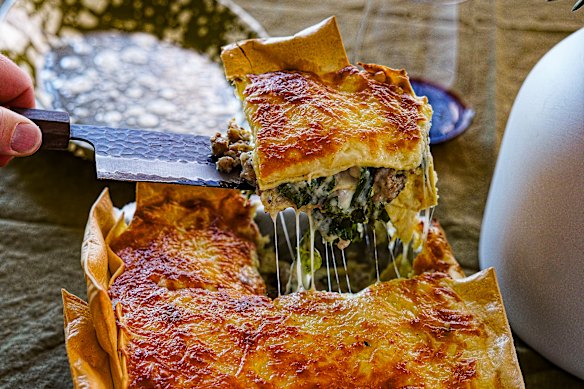 Three-cheese lasagne with overhanging edges for extra crispy bits.