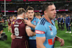 Harry Grant of the Maroons and Nathan Cleary of the Blues embrace at full time.
