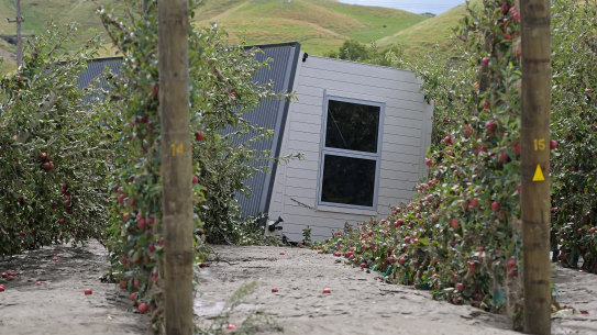 A house is washed into an orchard west of Napier, NZ, on February 16.