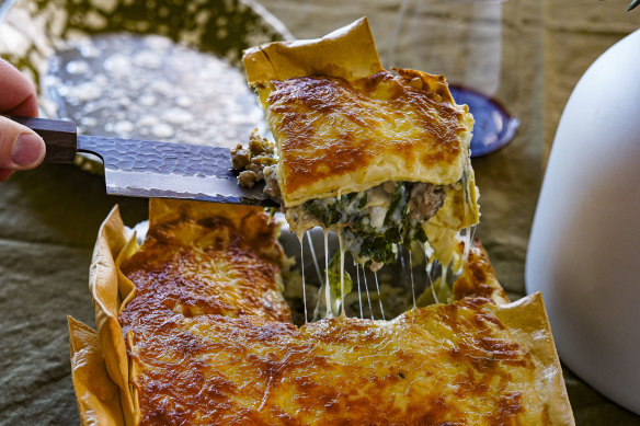 Three-cheese lasagne with overhanging edges for extra crispy bits.