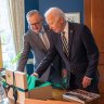Anthony Albanese and Joe Biden exchange gifts.