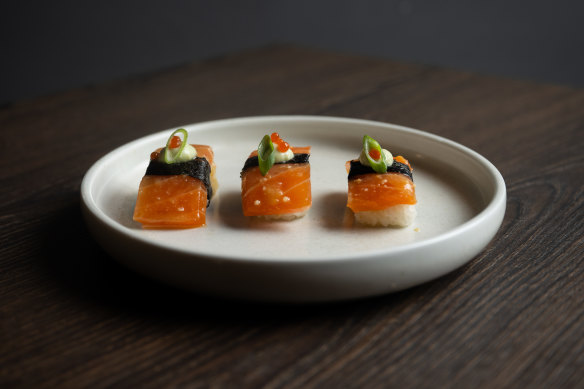 Miso salmon crudo nigiri with chilli citrus pearls and wasabi creme.