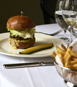 A cheeseburger and beer on tap is part of the relaxed offering.