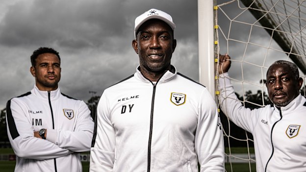 Dwight Yorke and his assistants at Macarthur FC, Russell Latapy (right) and James Meredith, are bucking a global trend against people of colour in key off-field sporting roles.