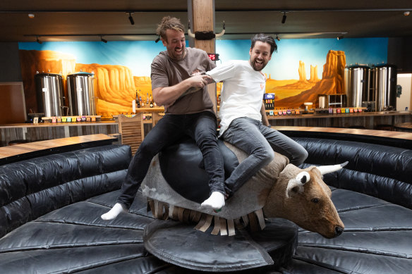 Karl van Buuren and Josh Uljans on the bucking bull at Moon Dog Wild West.