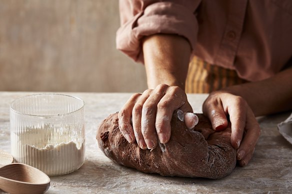 Knead the dough on a lightly floured surface until it is smooth and elastic.