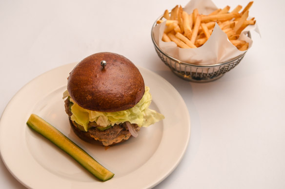 A very restaurant-y cheeseburger, served with thin, crisp fries.