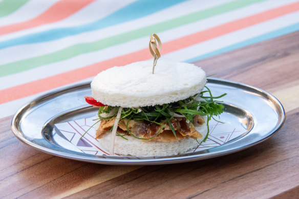 The chicken skin sandwich is layered with bright herbs and Filipino flavours.