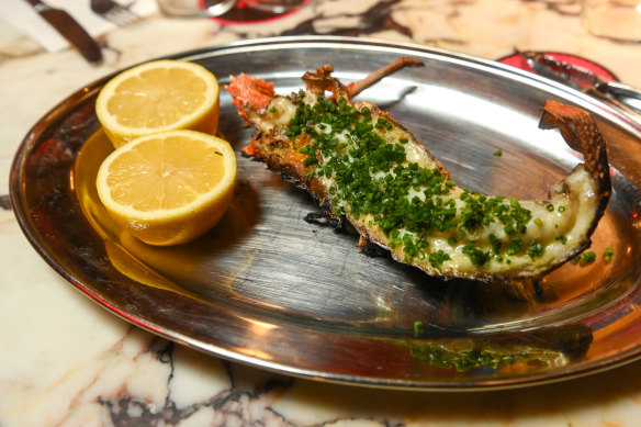 Coal-roasted half lobster with  green garlic butter.