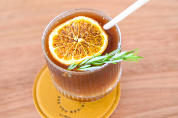 Yuzu iced black coffee with orange and rosemary.