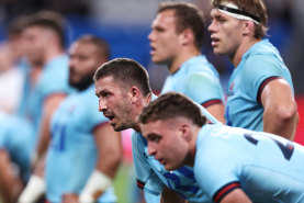 Jake Gordon and Waratahs teammates looking dejected after the game against the Chiefs.