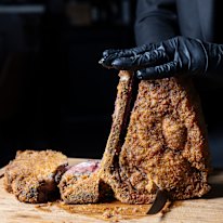 Bistecca fritta, a crumbed T-bone steak pan-fried in clarified butter then finished in the oven, is carved tableside at Made In Casa.