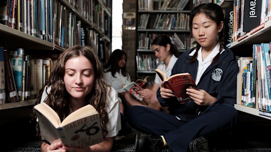 Burwood High School students (L-R) Tiare Ceran-Jerusalemy, Aditi Narwania, Lily Munier-Wotton, and Angela An in the school library on Wednesday.