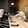 Chef Tomotaka Ishizuka behind the counter at Tomo-An kaiseki restaurant.