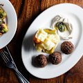 Falafel with tahini, pickles and zhoug.