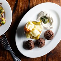Falafel with tahini, pickles and zhoug.