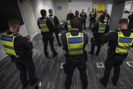 Members of Victoria Police Public Order Response Team take part in a pre-shift briefing.