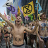 'We are overexposed': Climate activists strip, march through city streets