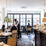 Fringed lampshades glow above each table in the downstairs dining room.