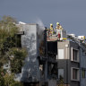 Emergency services attend a house fire in Dover Street, Truganina, on Thursday morning.