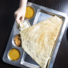 Tear the dosa, dip it in sambar and enjoy.