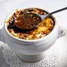 The soup's base is a reduce beef stock of depth and distinction; its cheesy topping grilled to melty magnificence.