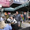 Bin 3 cafe and cellars owner Tom Mornement with customers on Friday afternoon. 