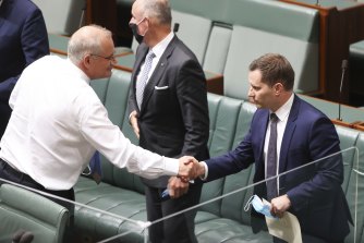 Working hand in glove: Prime Minister Scott Morrison and Immigration Minister Alex Hawke.